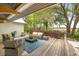 Relaxing outdoor patio with comfortable seating and peaceful views of the yard at 3060 Bohicket Rd, Johns Island, SC 29455