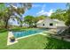 Enjoy a refreshing swim in this backyard pool offering stunning views of the surrounding water and landscape at 3060 Bohicket Rd, Johns Island, SC 29455