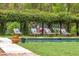 Tranquil poolside lounge area featuring cushioned chairs beneath a vine-covered pergola for ultimate relaxation at 3060 Bohicket Rd, Johns Island, SC 29455