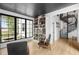 Stylish study with built-in bookshelves, a spiral staircase, and plenty of natural light at 3060 Bohicket Rd, Johns Island, SC 29455