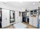Spacious walk-in closet features custom shelving, cabinets and a cushioned ottoman in the center at 3060 Bohicket Rd, Johns Island, SC 29455