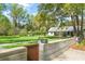 Serene yard featuring lush greenery, mature trees, and a stone pathway, creating a peaceful outdoor retreat at 3060 Bohicket Rd, Johns Island, SC 29455