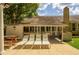 Backyard patio with sun loungers, picnic table, and outdoor grill at 307 Fairington Dr, Summerville, SC 29485