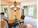 Charming dining room with stylish chandelier, adjacent living areas, and ample natural light at 307 Fairington Dr, Summerville, SC 29485