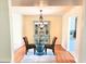 Elegant dining room featuring hardwood floors, stylish lighting and a decorative display cabinet at 307 Fairington Dr, Summerville, SC 29485