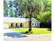 Charming brick home with lush front yard and mature palm tree for shaded curb appeal at 307 Fairington Dr, Summerville, SC 29485