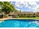 Sparkling backyard pool with tanning ledge and ample patio space perfect for relaxing and entertaining at 307 Fairington Dr, Summerville, SC 29485