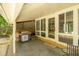 Covered poolside patio area with stainless steel grill, adjacent to sunroom at 307 Fairington Dr, Summerville, SC 29485