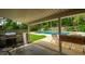 Covered poolside patio area with stainless steel grill at 307 Fairington Dr, Summerville, SC 29485