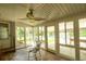 Bright sunroom featuring brick floors, fan, and views of the pool at 307 Fairington Dr, Summerville, SC 29485