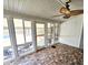 A sunroom featuring brick floors, multiple windows, and an outdoor view at 307 Fairington Dr, Summerville, SC 29485