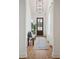 Bright entryway boasts light hardwood floors, a modern light fixture, and neutral decor at 316 Abercom Place Dr, Moncks Corner, SC 29461