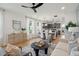 Bright living area showcases hardwood floors, a ceiling fan, and an open layout at 316 Abercom Place Dr, Moncks Corner, SC 29461
