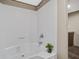 Bathroom featuring white tiled shower with a plant for decor, and a glimpse of the vanity at 320 Bedford Rd, Cross, SC 29436