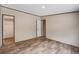 This empty bedroom features wood-look floors, a closet, and neutral-colored walls creating a clean space at 320 Bedford Rd, Cross, SC 29436
