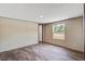 This bright, empty bedroom features wood-look floors, a window, and neutral-colored walls creating a cozy space at 320 Bedford Rd, Cross, SC 29436