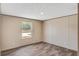 This bright, empty bedroom features wood-look floors, a window with views, and neutral-colored walls at 320 Bedford Rd, Cross, SC 29436