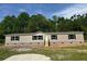 Charming single-story home with neutral siding, black shutters, and inviting front steps at 320 Bedford Rd, Cross, SC 29436