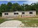 Charming single-story home with neutral siding, black shutters, and inviting front steps at 320 Bedford Rd, Cross, SC 29436