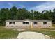 Charming single-story home with neutral siding, black shutters, and inviting front steps at 320 Bedford Rd, Cross, SC 29436