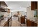 Open kitchen featuring an island, wooden cabinetry, and a view to the dining and living areas at 320 Bedford Rd, Cross, SC 29436