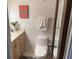 This stylish bathroom features a modern toilet, vanity with storage, and a unique butterfly wall art at 330 Concord St # 4B, Charleston, SC 29401