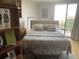 Inviting bedroom with a comfortable bed, accent pillows, and hardwood floors, offering a relaxing and stylish space with abundant natural light at 330 Concord St # 4B, Charleston, SC 29401