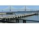 View of the bridge from the community featuring a pier and water views at 330 Concord St # 4B, Charleston, SC 29401