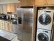 Functional kitchen includes modern stainless steel appliances, built-in washer/dryer, and lots of cabinet storage maximizing space and convenience at 330 Concord St # 4B, Charleston, SC 29401