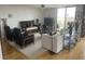 Spacious living room with hardwood floors, comfortable seating, elegant decor, and large windows for natural light, perfect for relaxation and entertainment at 330 Concord St # 4B, Charleston, SC 29401