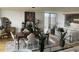Open-concept living room with dining area, features hardwood floors, natural light, and stylish furnishings, enhancing the airy and spacious feel at 330 Concord St # 4B, Charleston, SC 29401