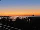 Stunning dusk water views, framed by trees, showcasing the condo community's prime location at 330 Concord St # 4B, Charleston, SC 29401