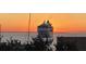Cruise ship setting sail on the water at sunset viewed from property's vantage point at 330 Concord St # 4B, Charleston, SC 29401