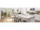 Bright kitchen features granite countertops, stainless steel appliances, and breakfast bar seating at 337 Pine Crest View Dr, Summerville, SC 29486
