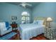 Cozy bedroom features a large window, chair, and dark hardwood floors at 3502 Stockton Dr, Mount Pleasant, SC 29466