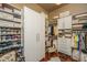 Custom closet boasts ample storage with built-in shelving, cabinets, drawers, and hanging racks at 3502 Stockton Dr, Mount Pleasant, SC 29466