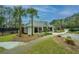 Well-maintained community building with benches, surrounded by landscaping and palm trees at 3502 Stockton Dr, Mount Pleasant, SC 29466