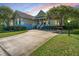 Charming home showcasing well-manicured landscaping, a welcoming front porch, and a spacious driveway at 3502 Stockton Dr, Mount Pleasant, SC 29466