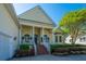 Inviting home exterior showcasing a charming front porch with decorative columns and manicured landscaping at 3502 Stockton Dr, Mount Pleasant, SC 29466