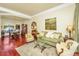 Comfortable living room featuring hardwood floors, a glass coffee table, and views into the dining area at 3502 Stockton Dr, Mount Pleasant, SC 29466