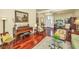 Elegant living room with hardwood floors, arched doorway, piano, and comfortable seating arrangement at 3502 Stockton Dr, Mount Pleasant, SC 29466