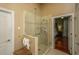 Beautiful shower with a glass door, a shower head, and a built-in shower bench and shelf at 3502 Stockton Dr, Mount Pleasant, SC 29466