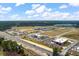 Broad aerial view of commercial area with multiple businesses, roads, and green spaces at 364 Deep River Rd, Summerville, SC 29486