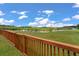 Scenic backyard view of a peaceful pond from the wooden fence at 364 Deep River Rd, Summerville, SC 29486