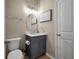 Charming bathroom with gray vanity, oval mirror, and neutral wall color at 364 Deep River Rd, Summerville, SC 29486