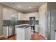 Contemporary kitchen boasts stainless steel appliances and granite counters with island at 364 Deep River Rd, Summerville, SC 29486