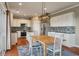 Bright kitchen with white cabinets, stainless steel appliances, and a stylish backsplash at 364 Deep River Rd, Summerville, SC 29486