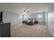 Spacious bedroom with large windows, ceiling fan, and plush carpeting at 364 Deep River Rd, Summerville, SC 29486