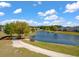 Scenic pond surrounded by lush greenery and walking trails creates a peaceful setting for residents to enjoy at 364 Deep River Rd, Summerville, SC 29486