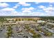 Shopping center with parking and retail stores under a blue sky with fluffy white clouds at 364 Deep River Rd, Summerville, SC 29486